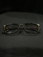 OPTICA Jerry shiny black cateye frames with 3D finish and gold side rods. Medium size.