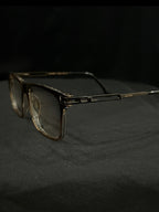 OPTICA Jerry shiny black rectangular frames with gold accents and anti-blue ray lenses.