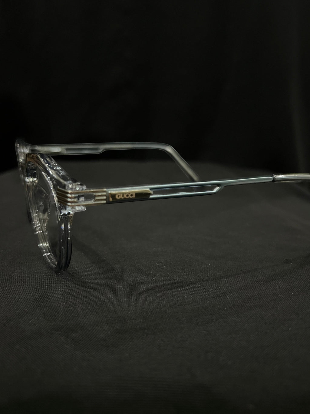 OPTICA Kocka round clear plastic frames with black kitty corner details and Gucci logo on the temple.