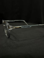 OPTICA Kocka round clear plastic frames with black kitty corner details and Gucci logo on the temple.