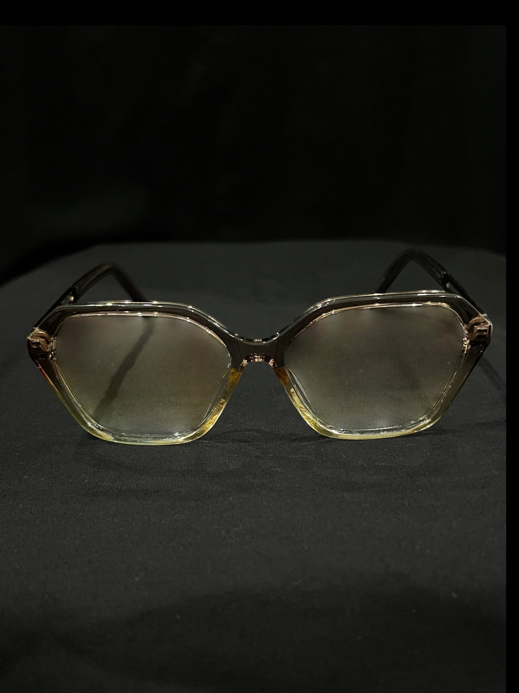 OPTICA geometric octagonal eyeglasses in translucent light brown acetate with angular frames and gradient lenses.
