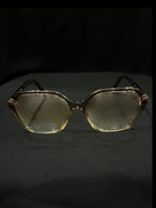 OPTICA geometric octagonal eyeglasses in translucent light brown acetate with angular frames and gradient lenses.