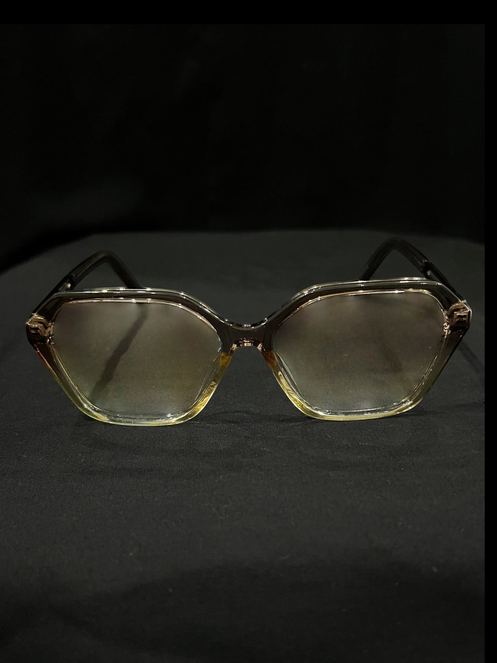 OPTICA geometric octagonal eyeglasses in translucent light brown acetate with gradient lenses.