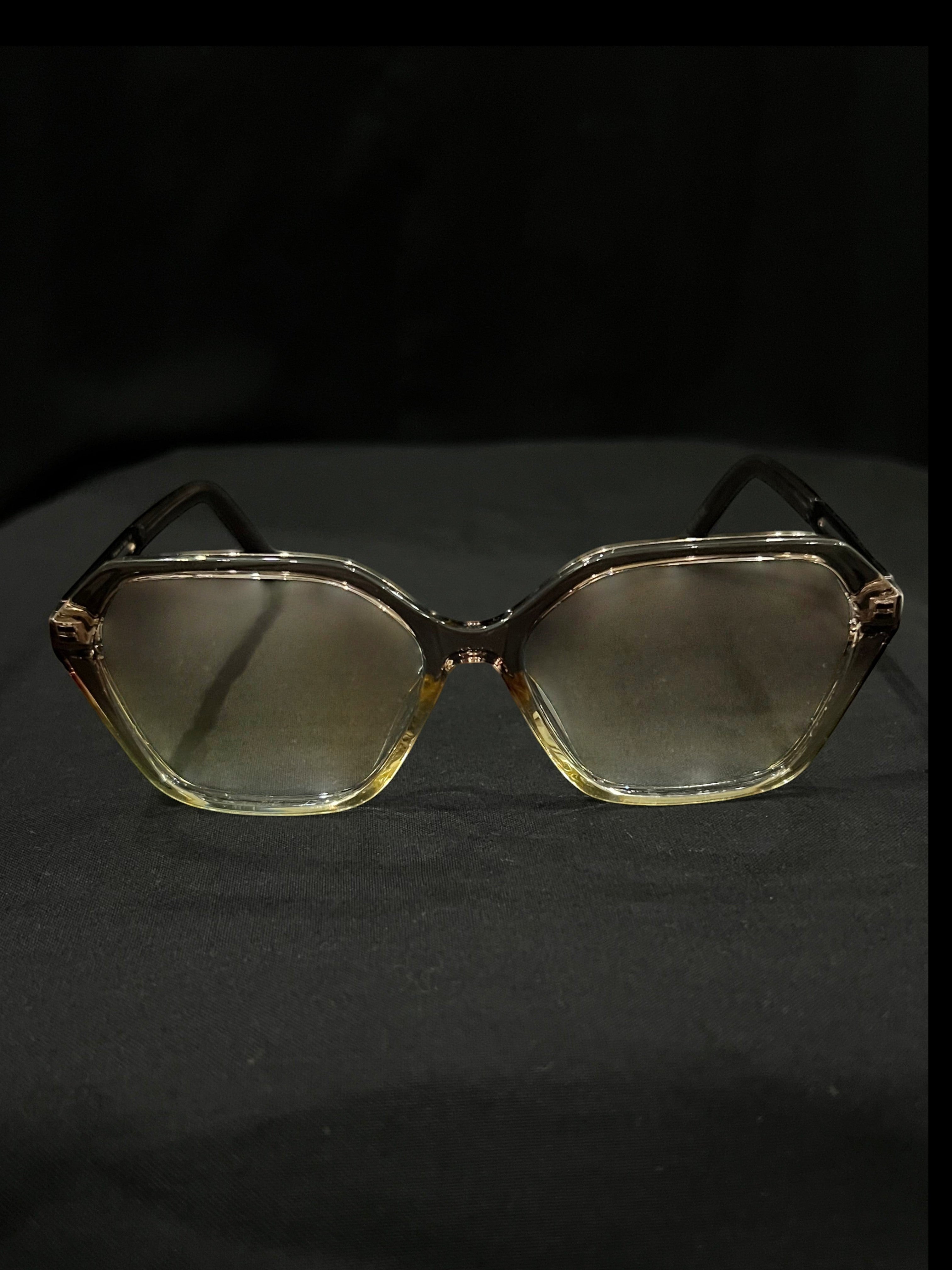 OPTICA geometric octagonal eyeglasses in translucent light brown acetate with gradient lenses.