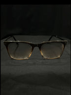 OPTICA IRIS oversized translucent brown rectangle eyeglasses with thick borders and anti-blue ray lenses.