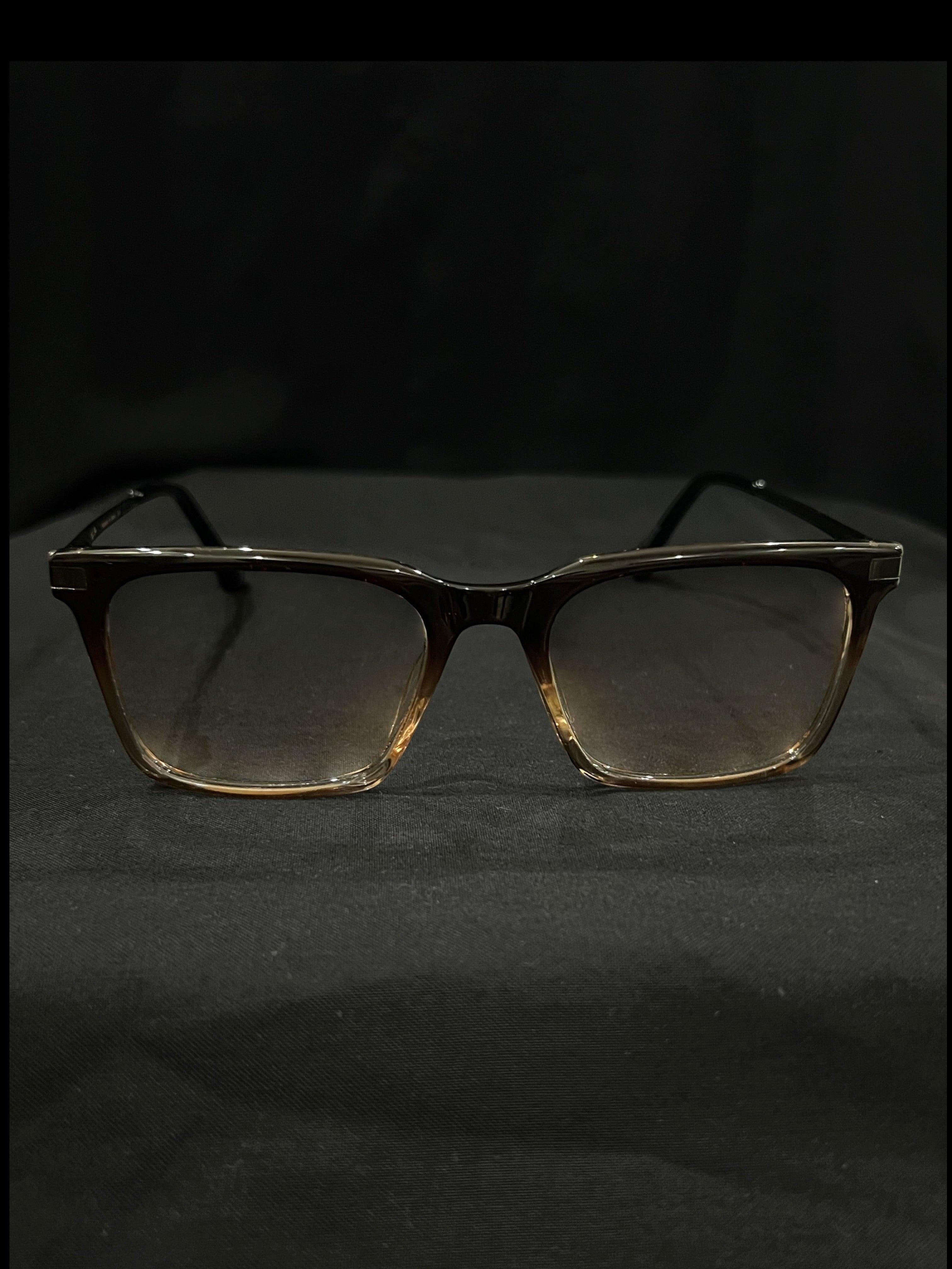 OPTICA IRIS oversized translucent brown rectangle eyeglasses with thick borders and anti-blue ray lenses.