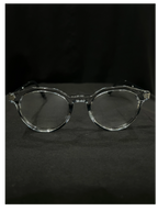 OPTICA Kocka round clear plastic eyeglasses with black kitty corner details. Suitable for medium to heavy faces.