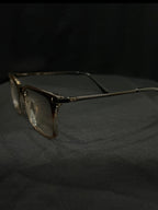 OPTICA IRIS oversized translucent rectangle eyeglasses with chunky brown and clear frames and anti-blue ray lenses.