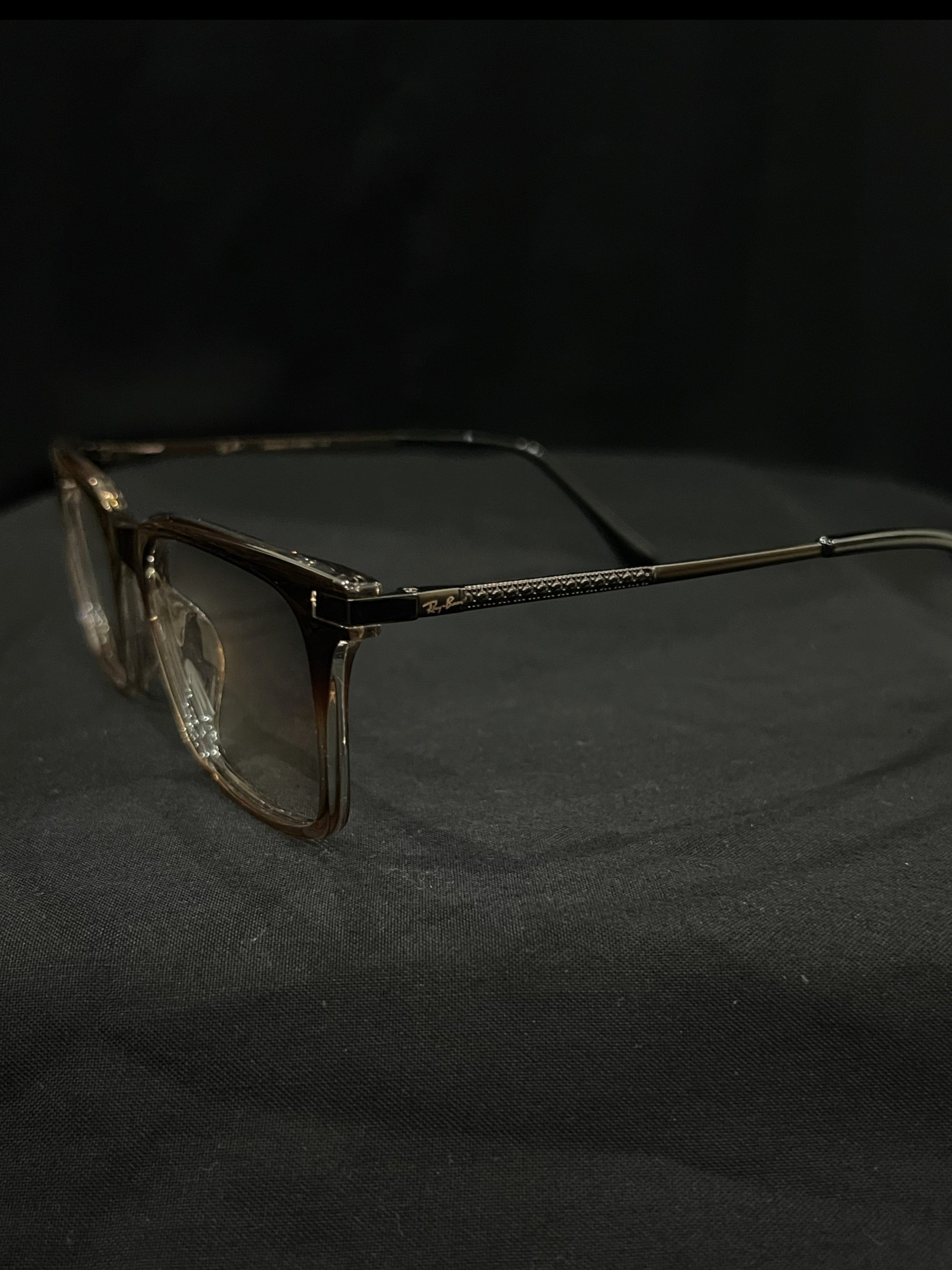 OPTICA IRIS oversized translucent rectangle eyeglasses with chunky brown and clear frames and anti-blue ray lenses.