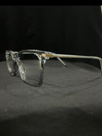 OPTICA IRIS translucent oversized rectangle eyeglasses with thick borders and gold temple accents.