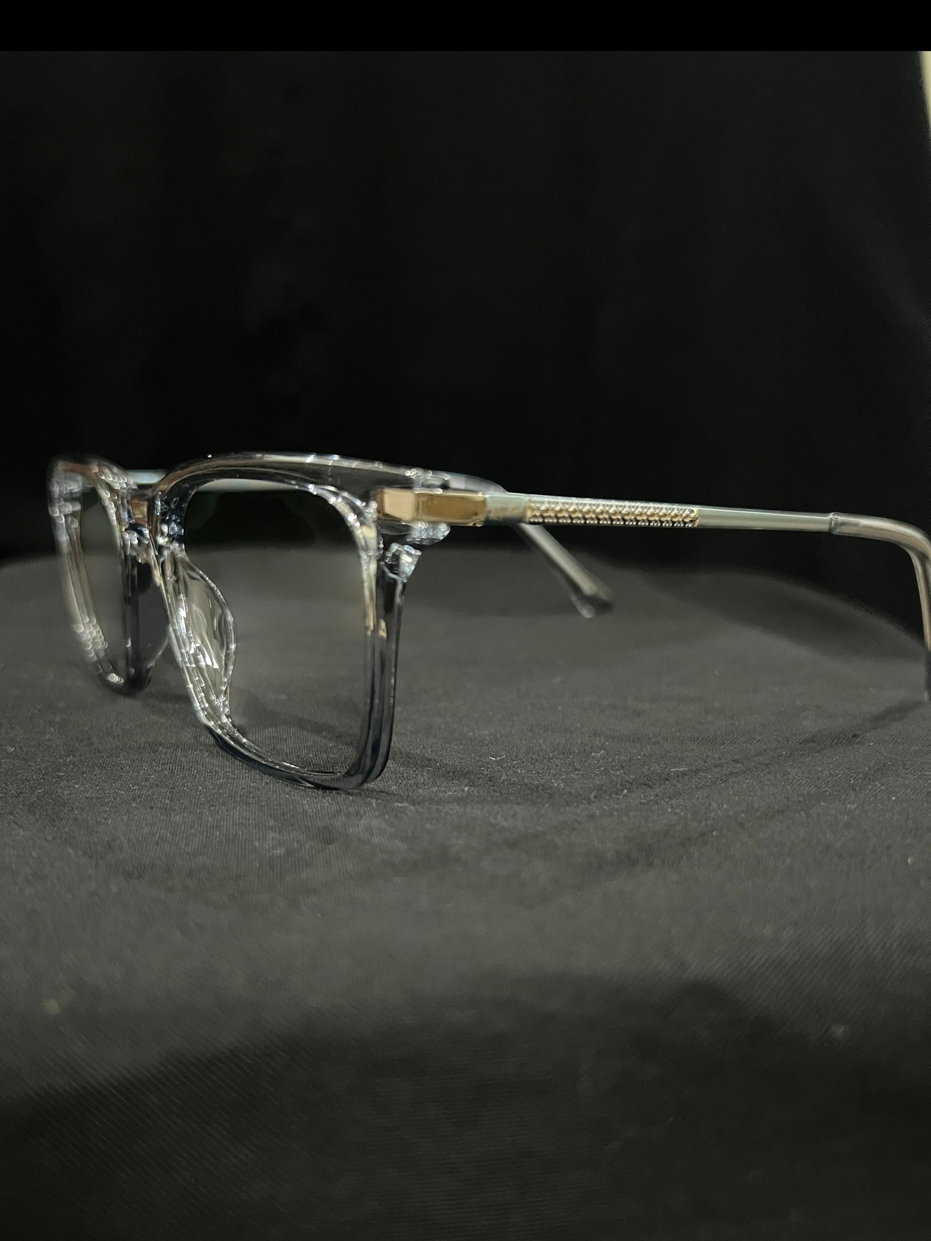 OPTICA IRIS translucent oversized rectangle eyeglasses with thick borders and gold temple accents.